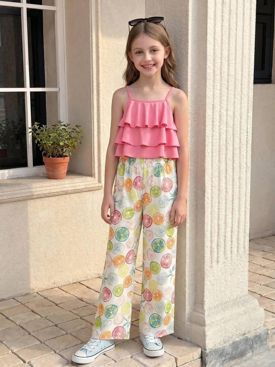 Tween girls blue 2-piece vacation outfit set featuring a tiered ruffle spaghetti strap camisole and loose high-waist pants.