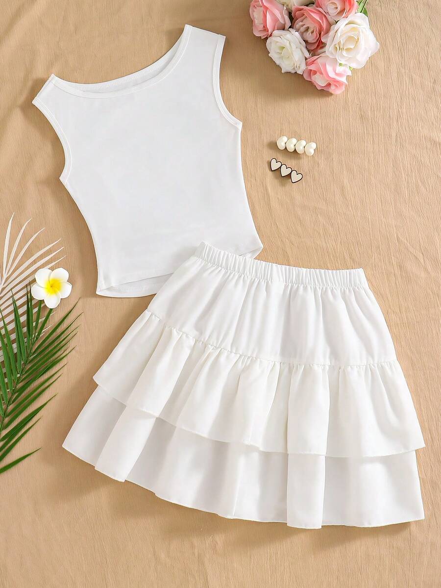 Light blue two-piece outfit set for tween girls with a sleeveless round neck vest top and a tiered ruffle cake skirt featuring a plant pattern.