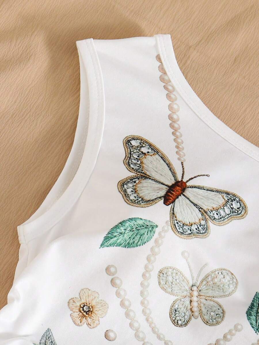 Light blue two-piece outfit set for tween girls with a sleeveless round neck vest top and a tiered ruffle cake skirt featuring a plant pattern.