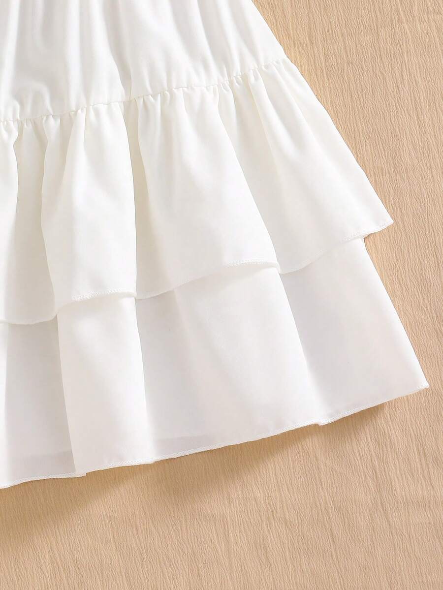 Light blue two-piece outfit set for tween girls with a sleeveless round neck vest top and a tiered ruffle cake skirt featuring a plant pattern.