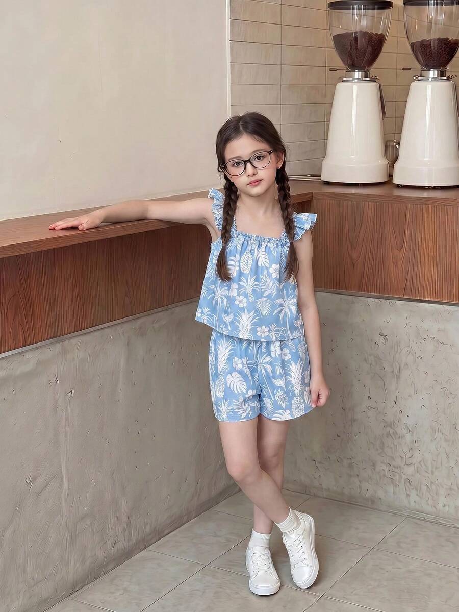 Tween girl wearing a blue and white striped sleeveless top featuring embroidery details and ruffle trim with matching shorts.