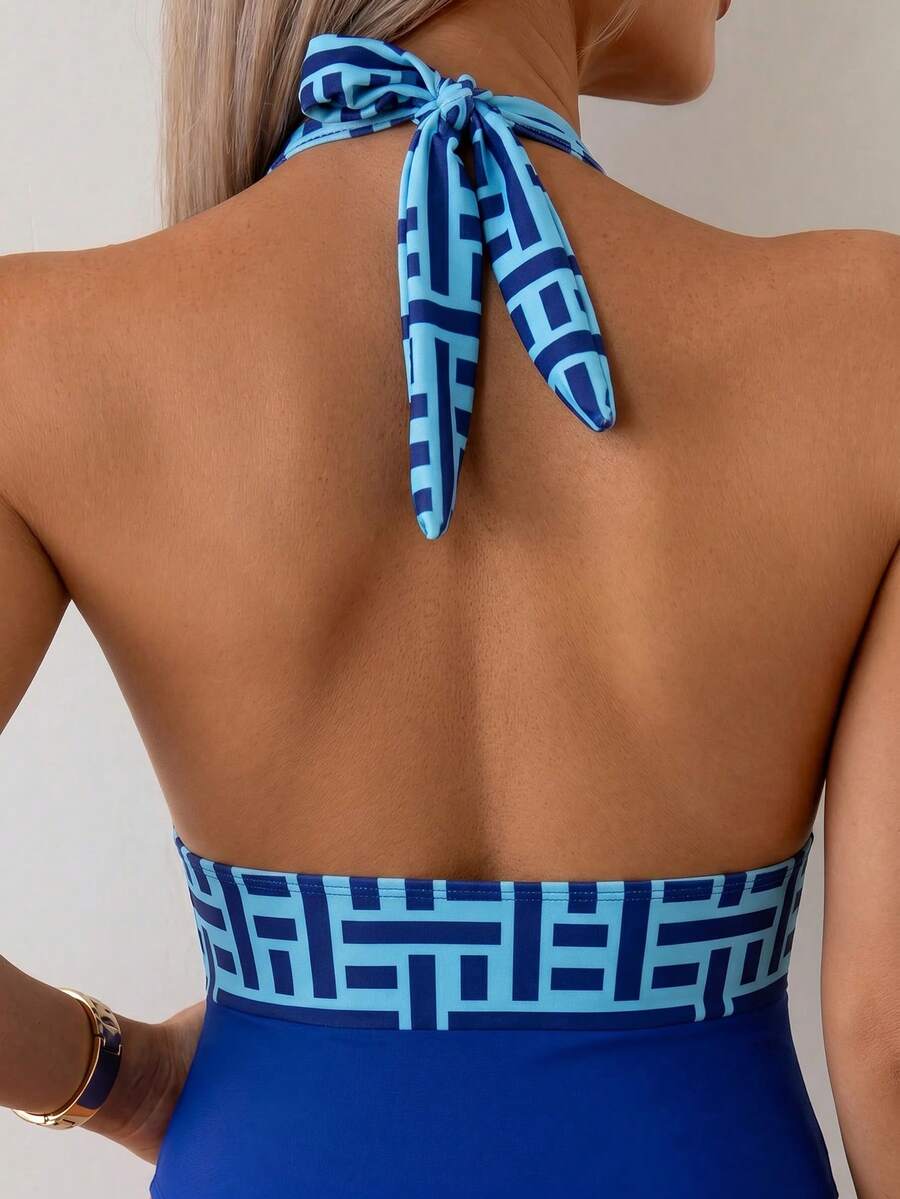 Apricot women's one-piece swimsuit featuring a halter neckline, backless tie-back detail, and ruched knitted fabric.