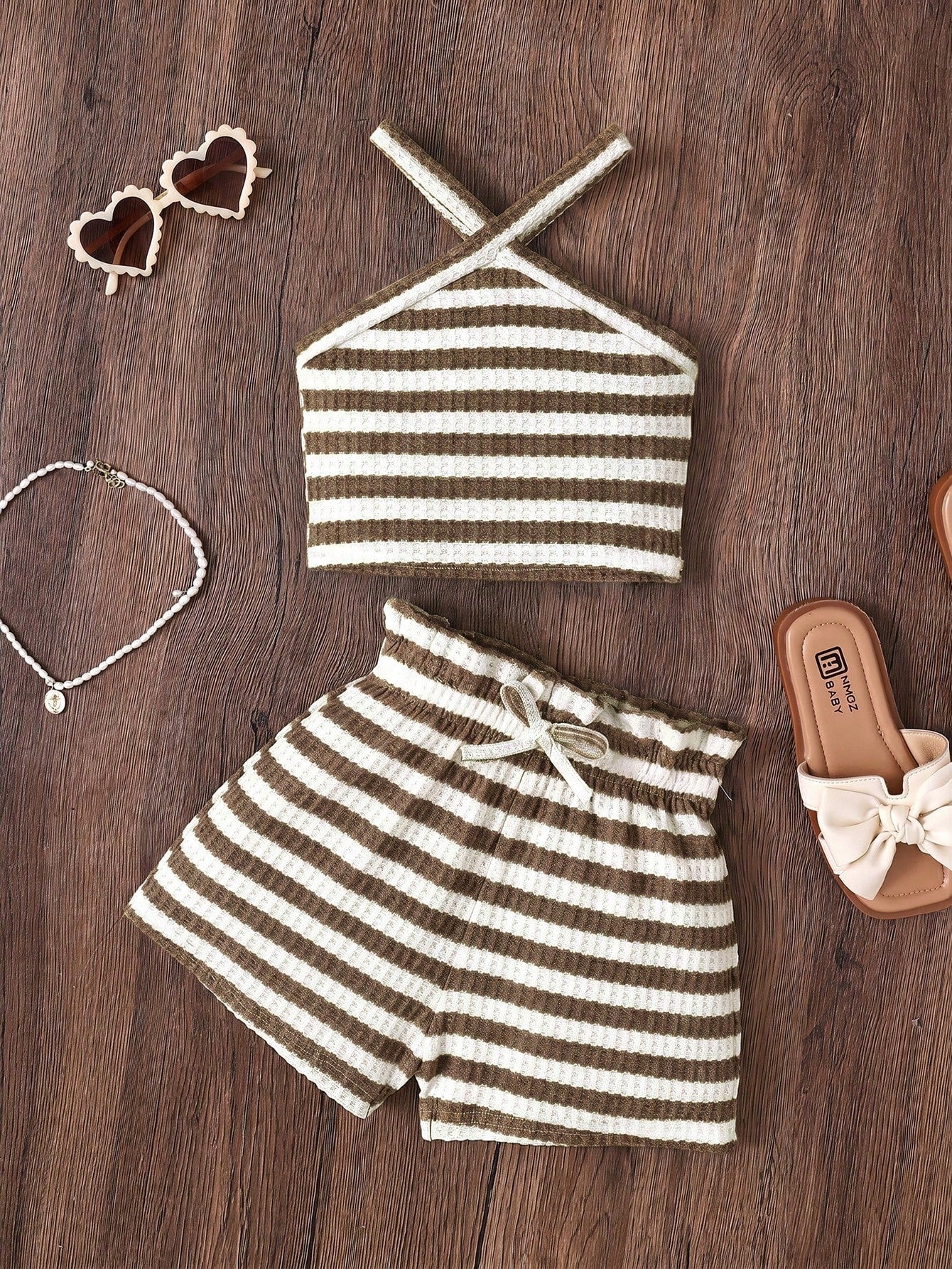 Tween girl 2-piece casual outfit set featuring a solid beige knit halter sleeveless top with belted detail and matching shorts.