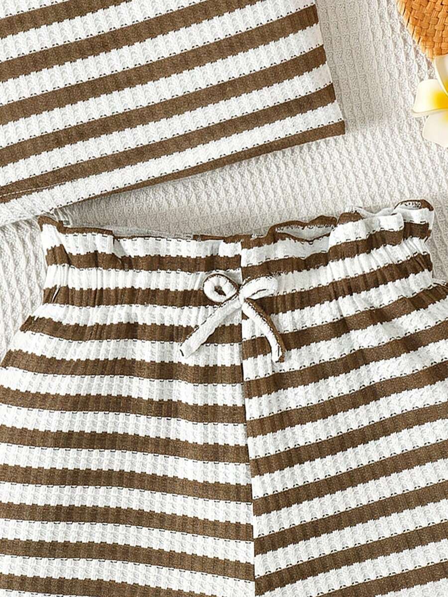 Tween girl 2-piece casual outfit set featuring a solid beige knit halter sleeveless top with belted detail and matching shorts.