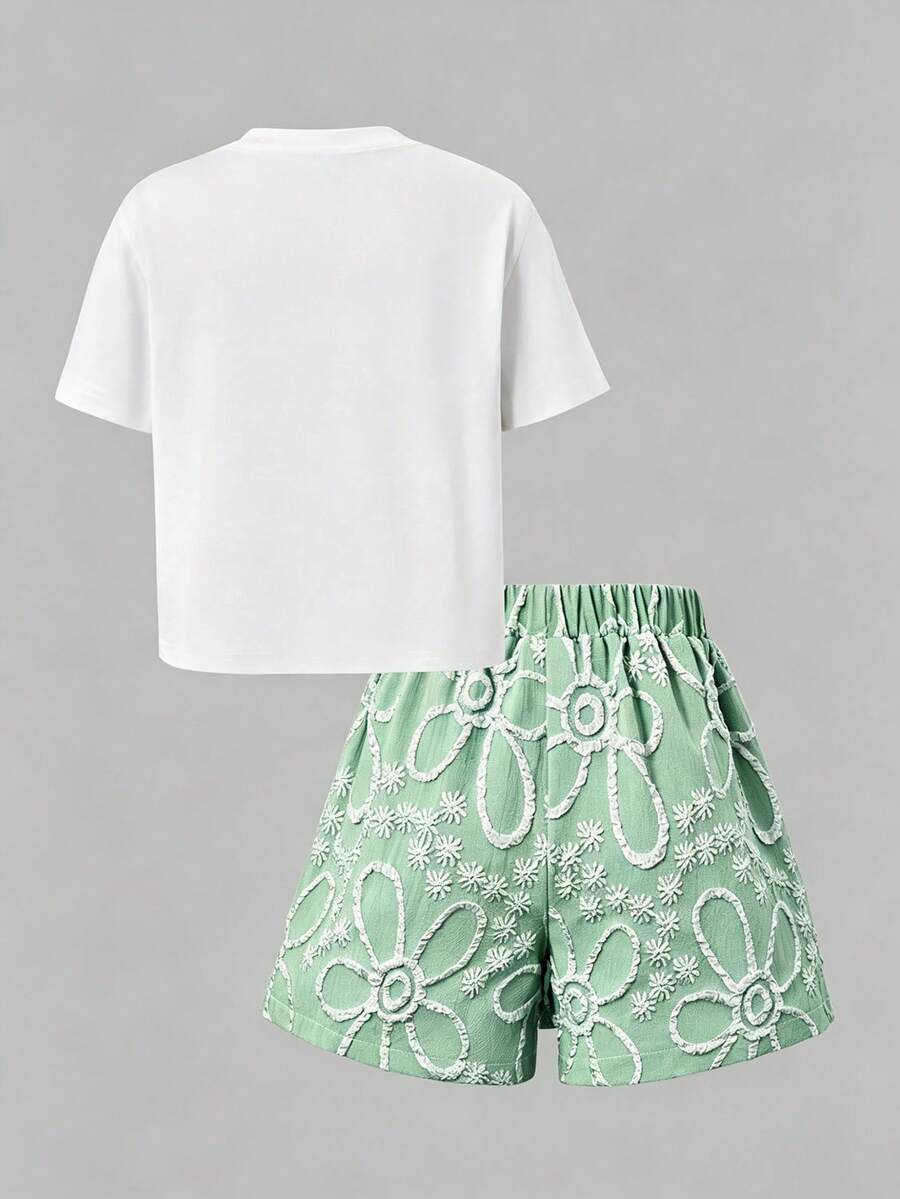 Tween girls 2-piece blue outfit featuring a short sleeve round neck t-shirt with a bow front detail and an asymmetric wrap skort.