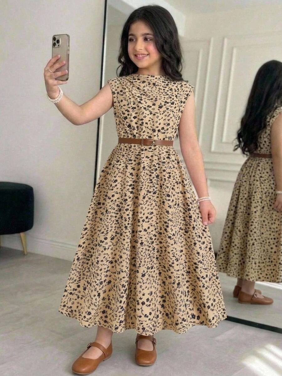 Tween girl wearing an apricot plant print long dress featuring a stand collar, short sleeves, high waist, flared hem, and back zipper closure.
