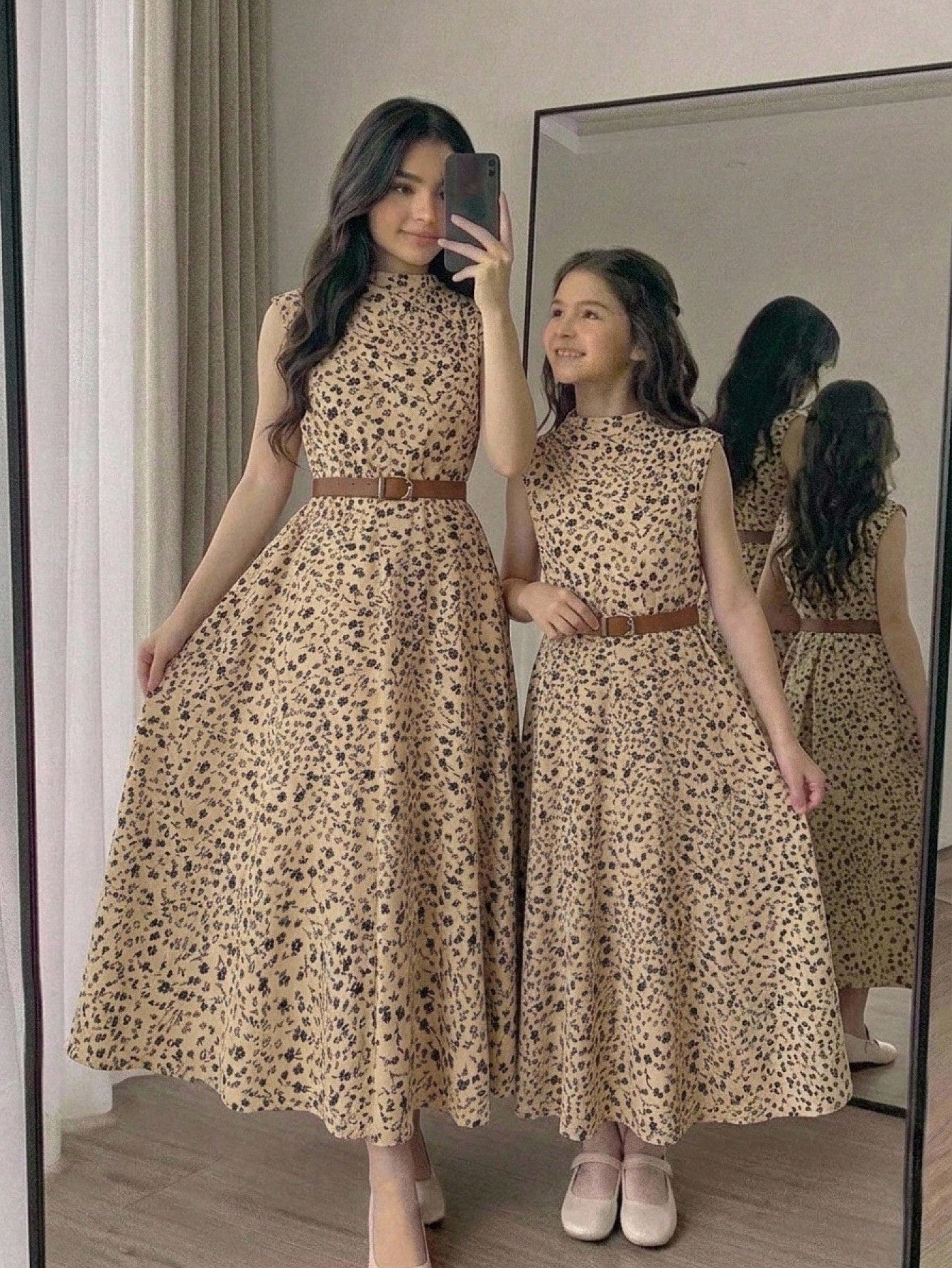 Tween girl wearing an apricot plant print long dress featuring a stand collar, short sleeves, high waist, flared hem, and back zipper closure.