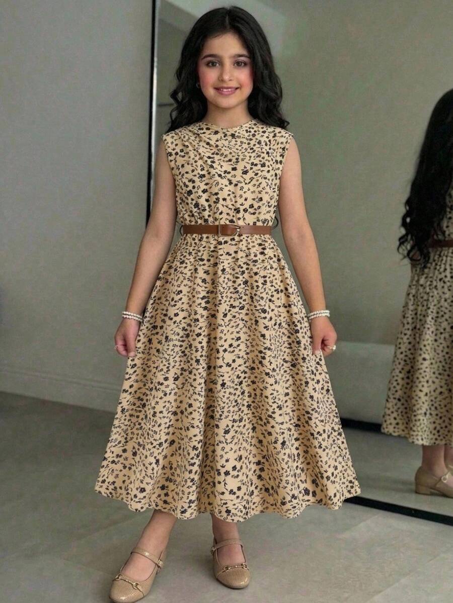 Tween girl wearing an apricot plant print long dress featuring a stand collar, short sleeves, high waist, flared hem, and back zipper closure.