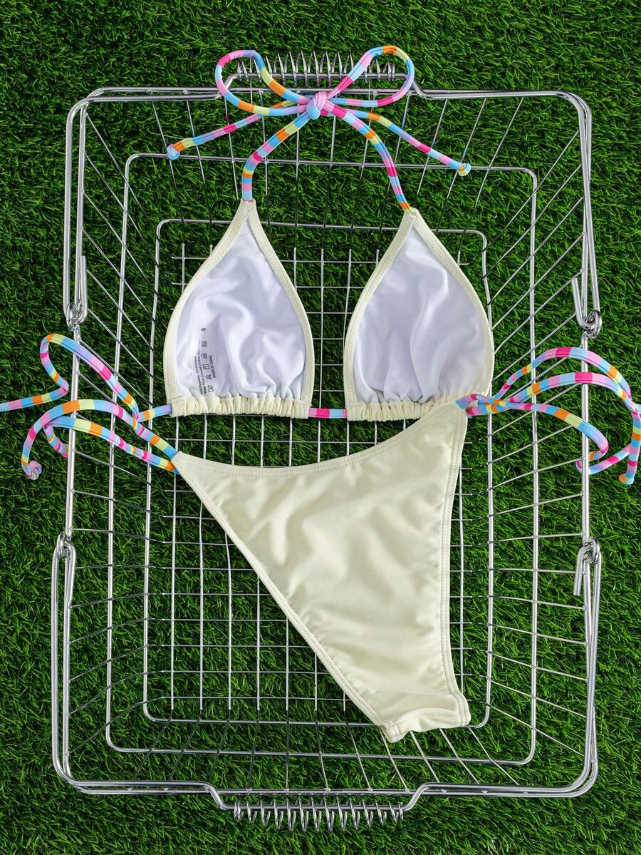 Women's striped halter bikini top with removable padding and matching tie-side low-waist swimsuit bottoms.