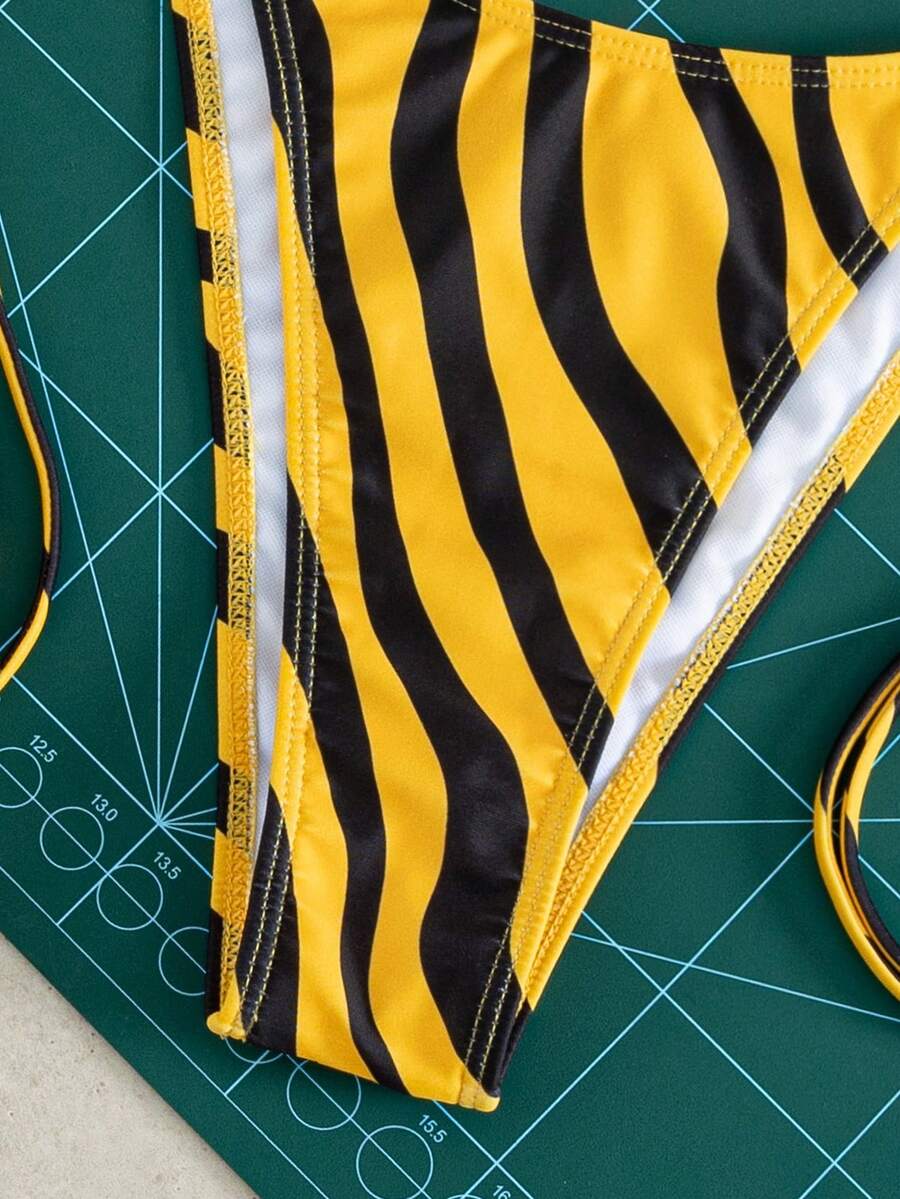 Women's striped halter bikini top with removable padding and matching tie-side low-waist swimsuit bottoms.