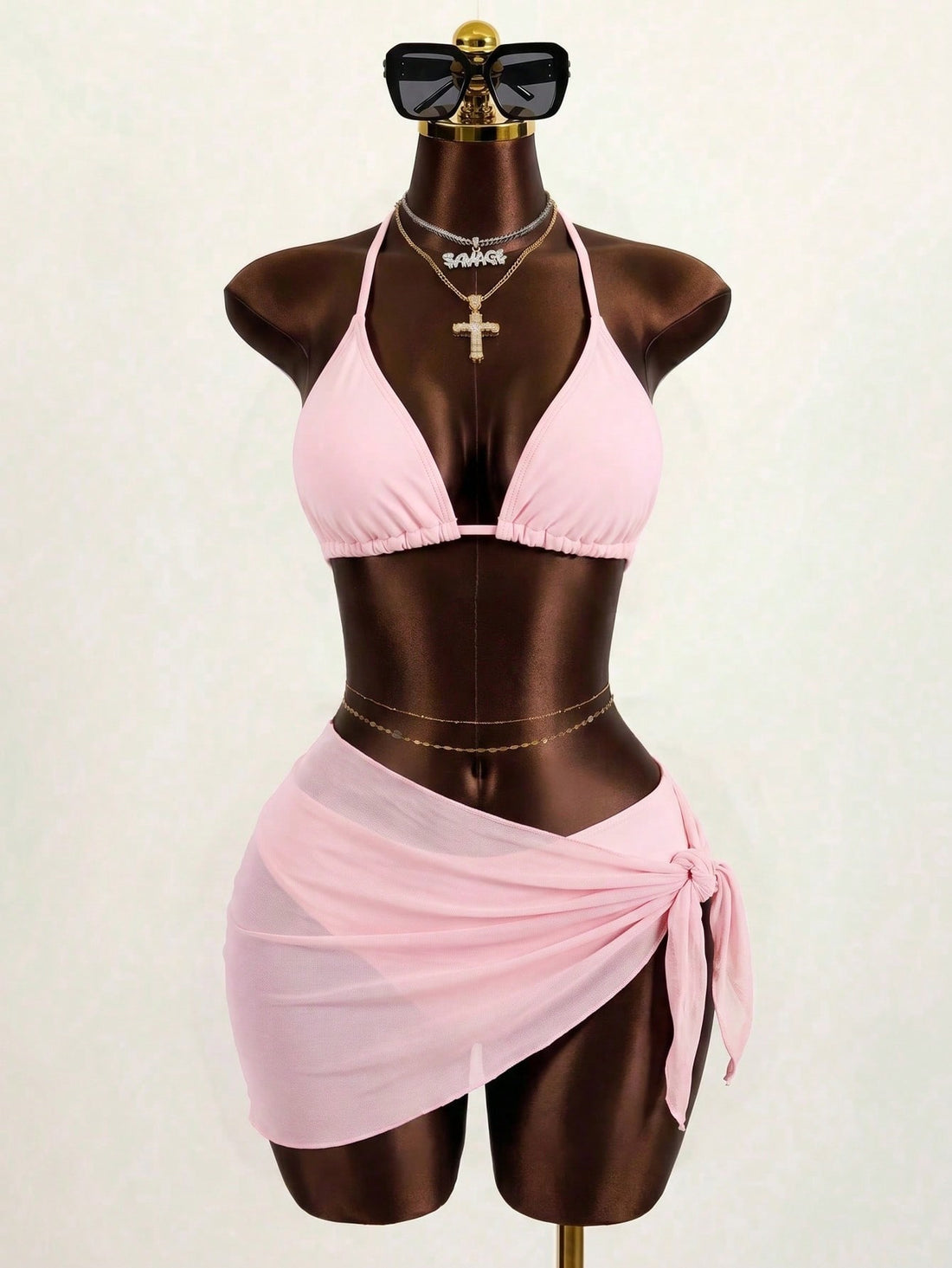 Pink 3-piece boho bikini set featuring a wireless triangle halter top with knot lace up detail and high waist bikini bottoms with matching skirt.