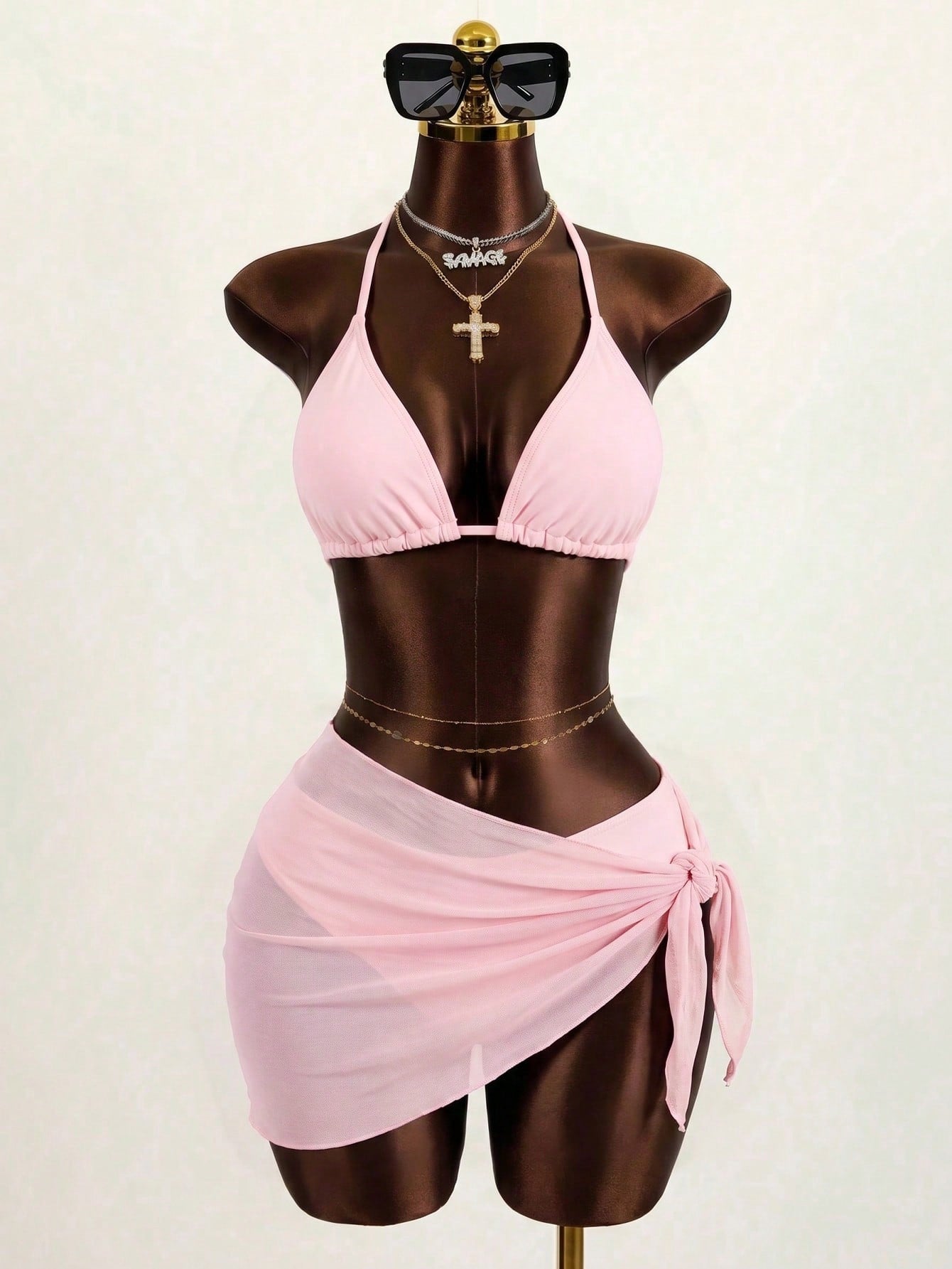 Pink 3-piece boho bikini set featuring a wireless triangle halter top with knot lace up detail and high waist bikini bottoms with matching skirt.