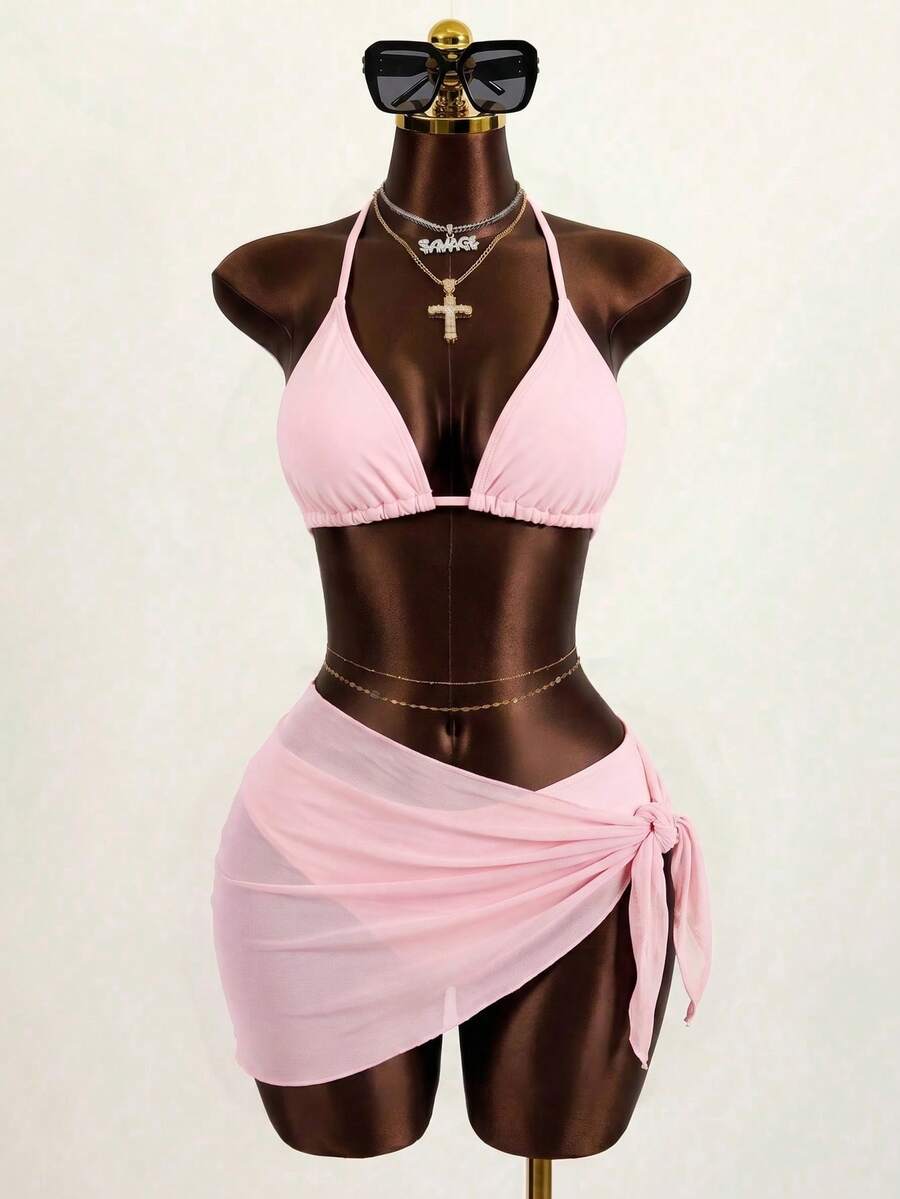 Pink 3-piece boho bikini set featuring a wireless triangle halter top with knot lace up detail and high waist bikini bottoms with matching skirt.