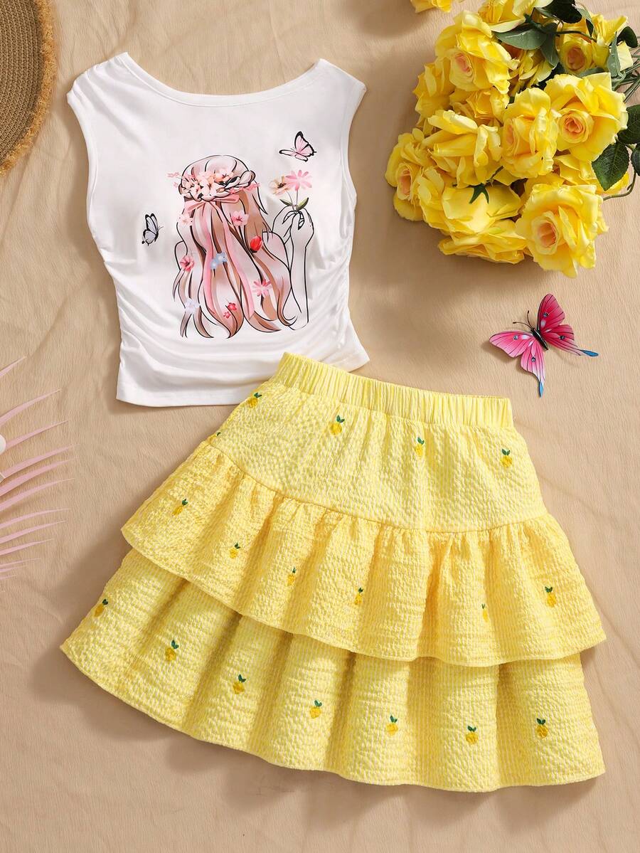 Light blue two-piece outfit set for tween girls with a sleeveless round neck vest top and a tiered ruffle cake skirt featuring a plant pattern.