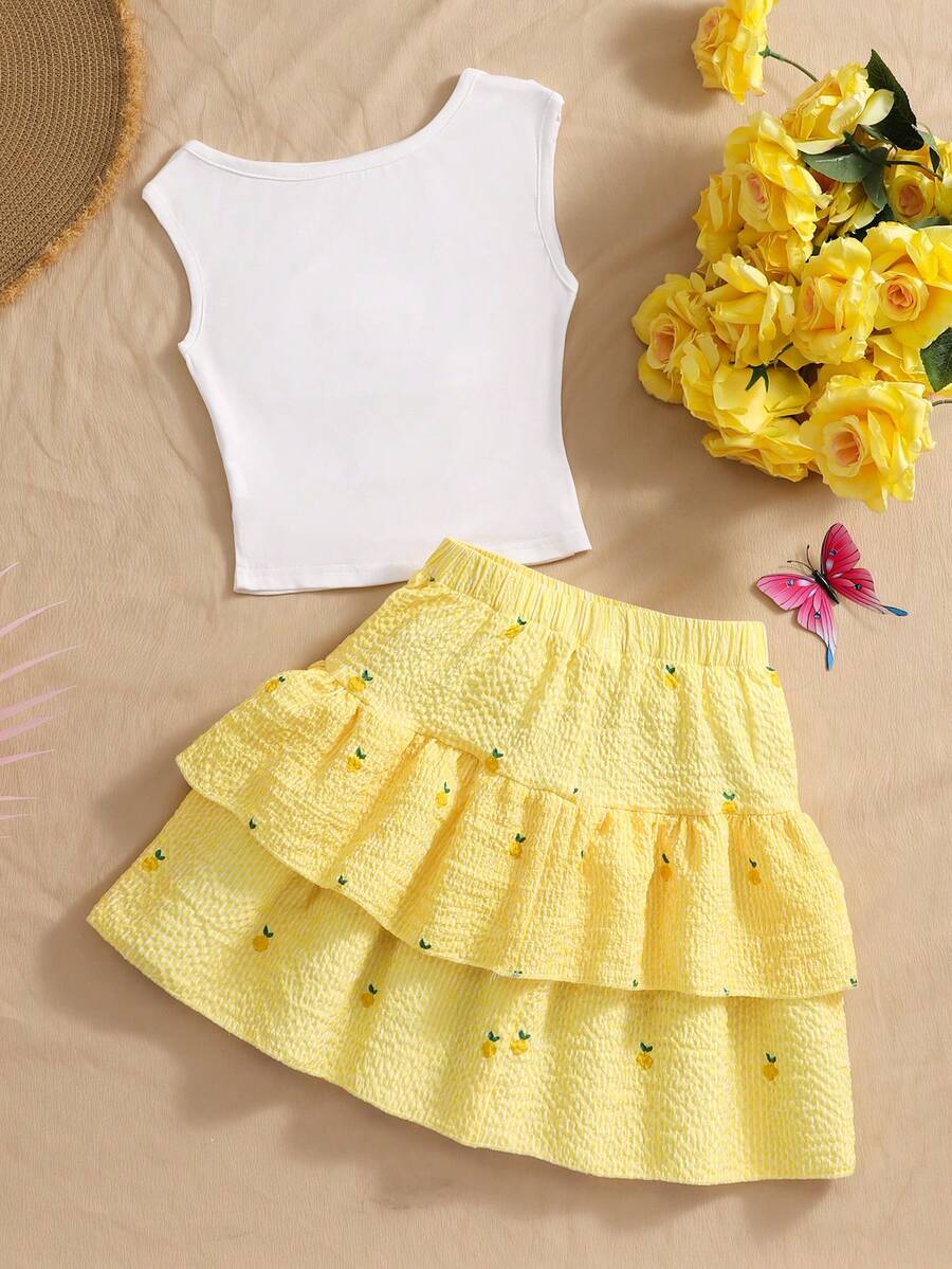 Light blue two-piece outfit set for tween girls with a sleeveless round neck vest top and a tiered ruffle cake skirt featuring a plant pattern.