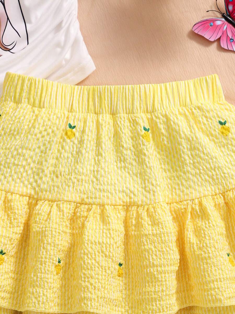 Light blue two-piece outfit set for tween girls with a sleeveless round neck vest top and a tiered ruffle cake skirt featuring a plant pattern.
