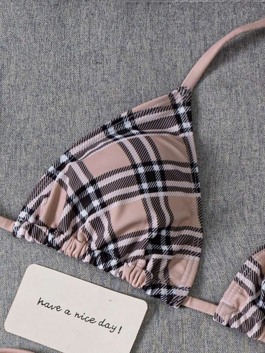 Women's 2-piece halter bikini set featuring geometric print, triangle cups with removable padding, and side tie bikini bottoms