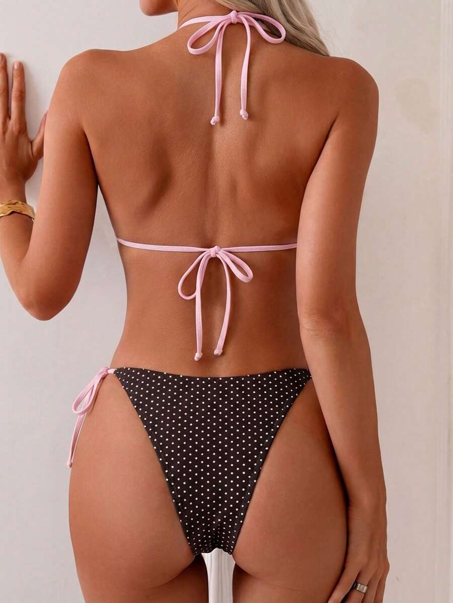 Women's tropical print two-piece halter bikini set featuring wireless triangle cups with tie-back detail and high-waist bikini bottoms.