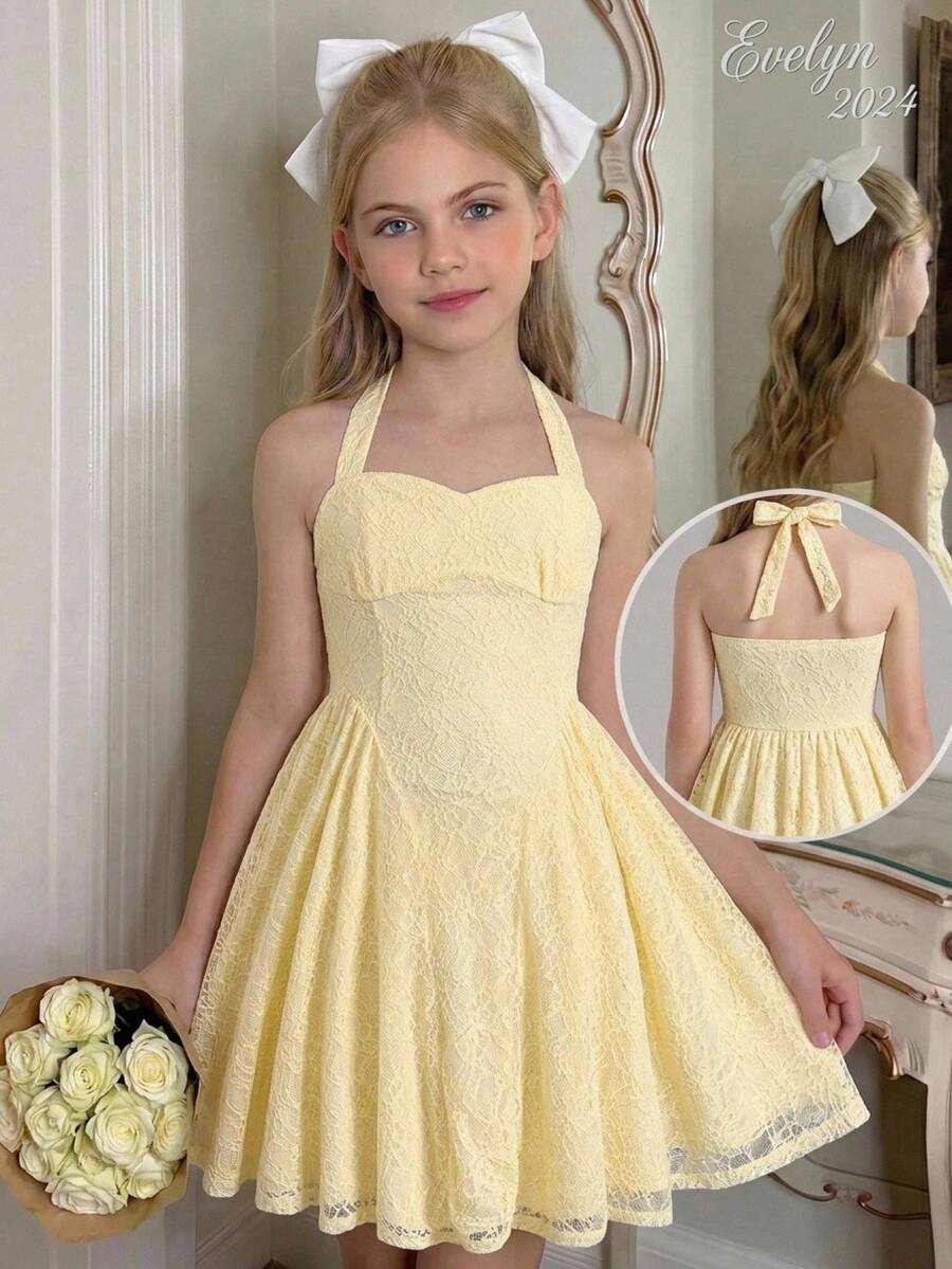 Black and white polka dot cami dress for tween girls featuring a square neckline, high waist, and flared short A-line hem.