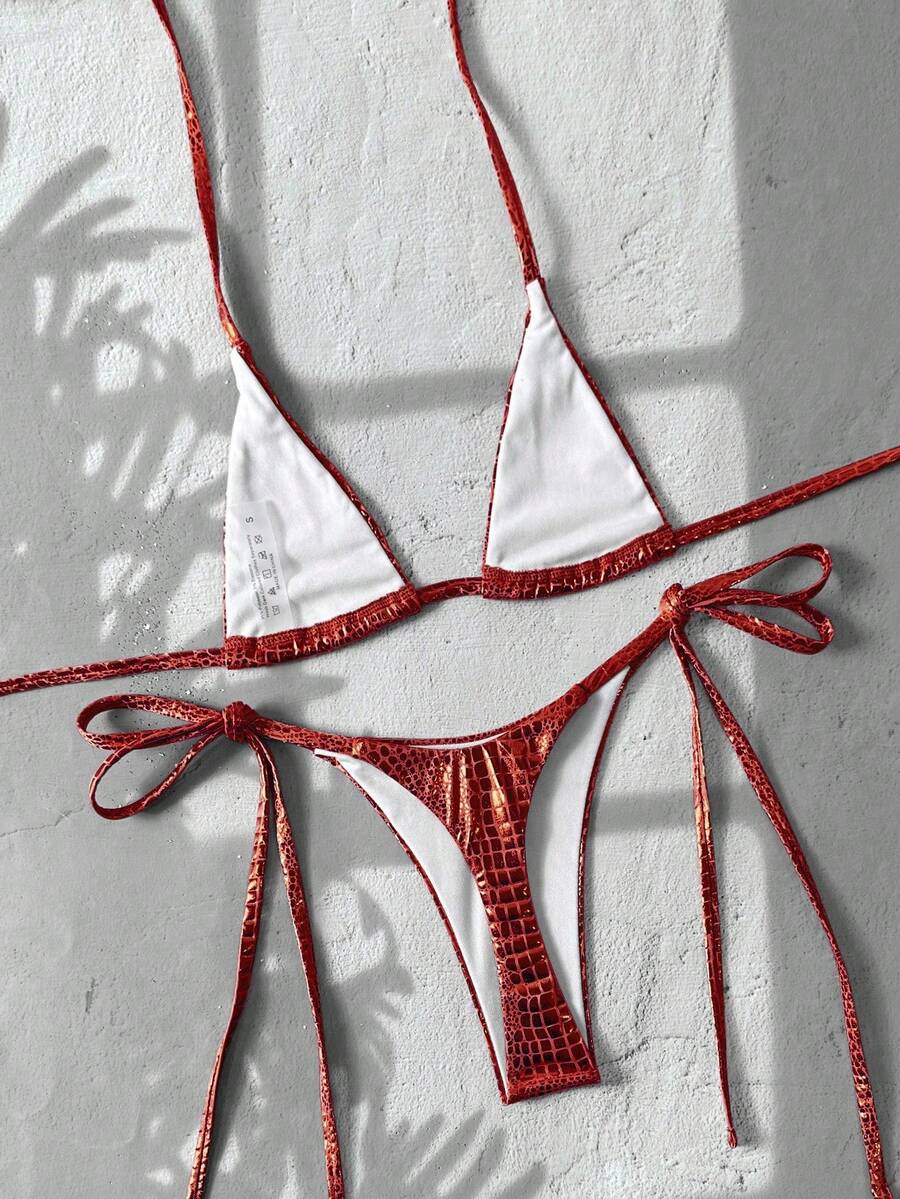 Black 2-piece snakeskin textured halter bikini set for women featuring high waist tie side bottoms and triangle cups.
