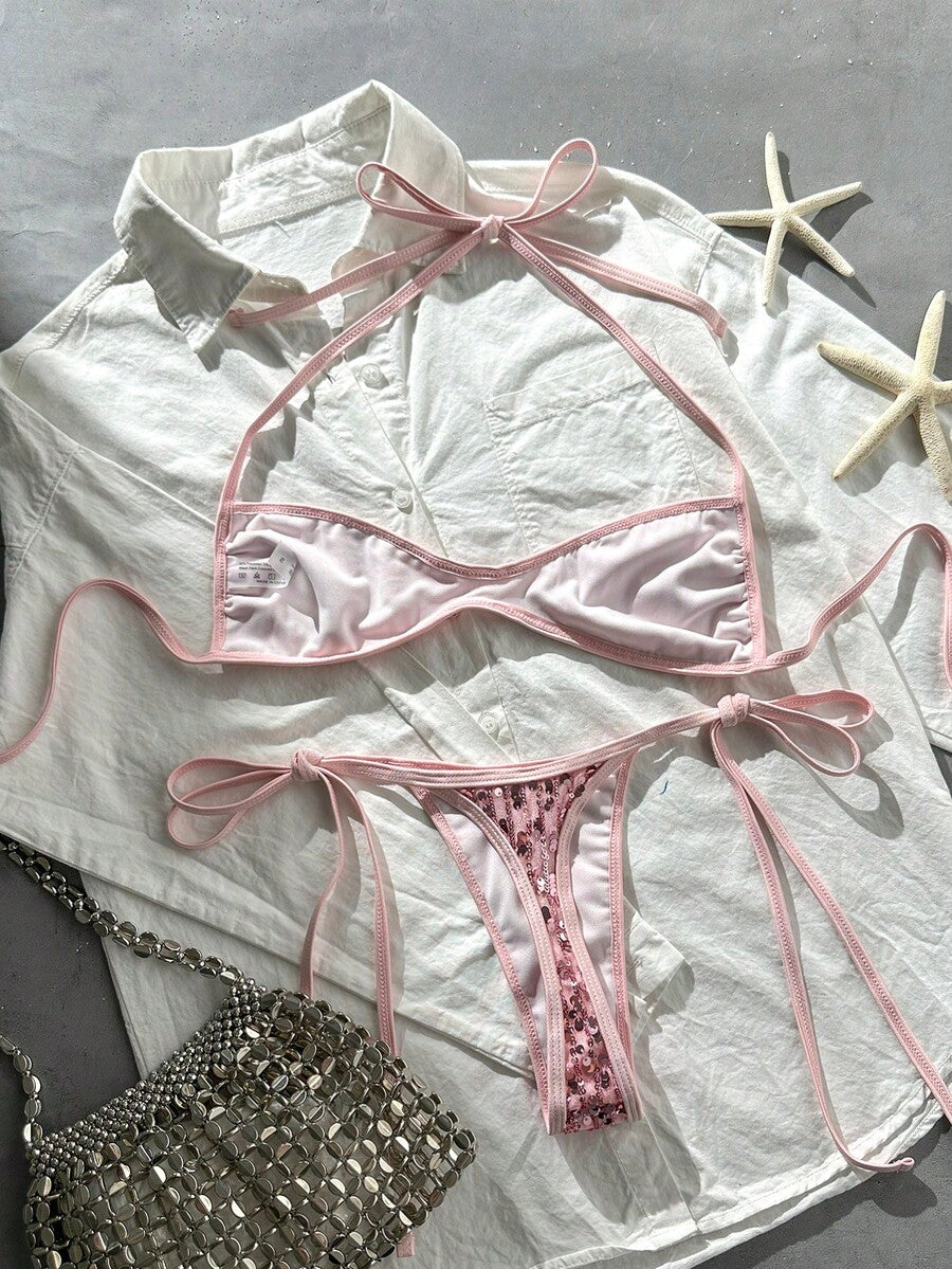 Apricot 2-piece sequin textured halter bikini set featuring a wireless top with lace-up backless ties and matching low-waist side-tie thong bottoms.