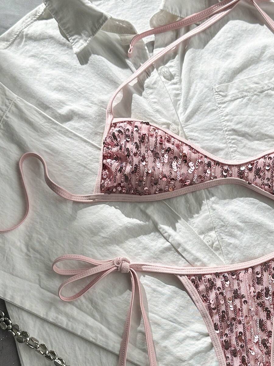 Apricot 2-piece sequin textured halter bikini set featuring a wireless top with lace-up backless ties and matching low-waist side-tie thong bottoms.