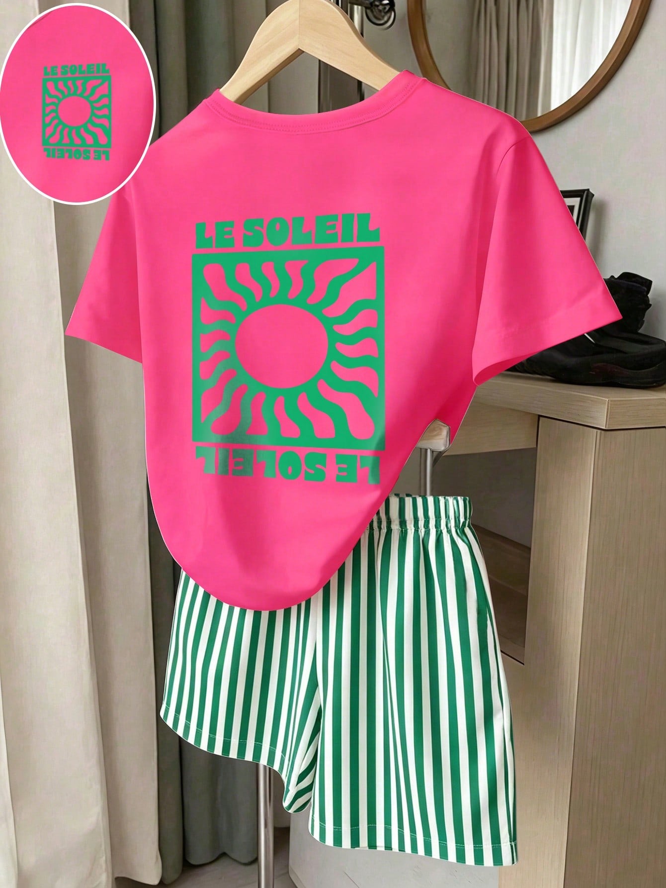 Girls' multicolor short sleeve T-shirt and shorts set featuring a cute cherry and bow print with round neck top and matching shorts.