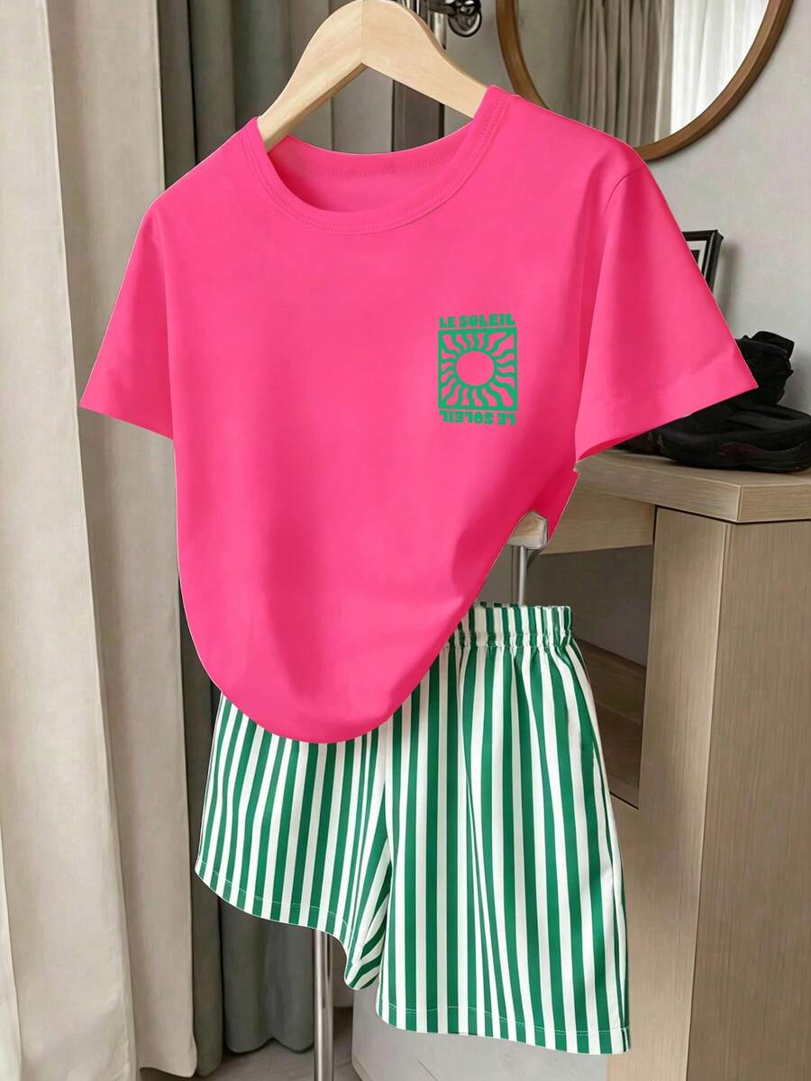 Girls' multicolor short sleeve T-shirt and shorts set featuring a cute cherry and bow print with round neck top and matching shorts.