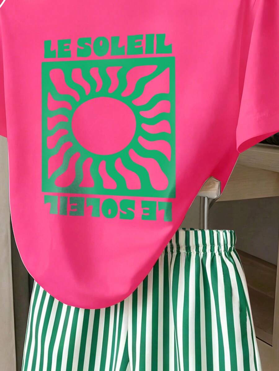 Girls' multicolor short sleeve T-shirt and shorts set featuring a cute cherry and bow print with round neck top and matching shorts.