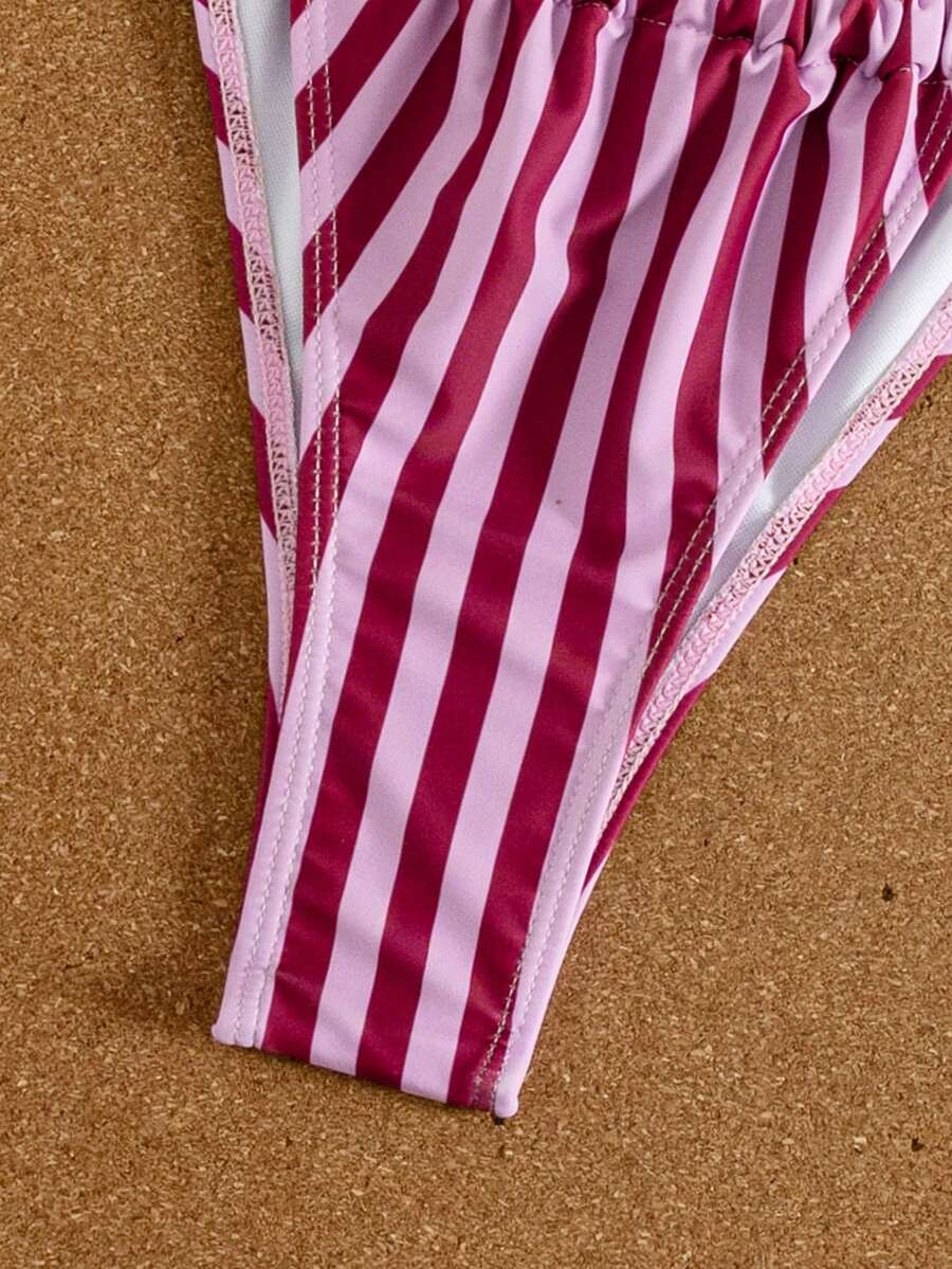 Women's striped halter two-piece swimsuit featuring a lace-up triangle top with removable padding and high-cut low-waist bikini bottoms.
