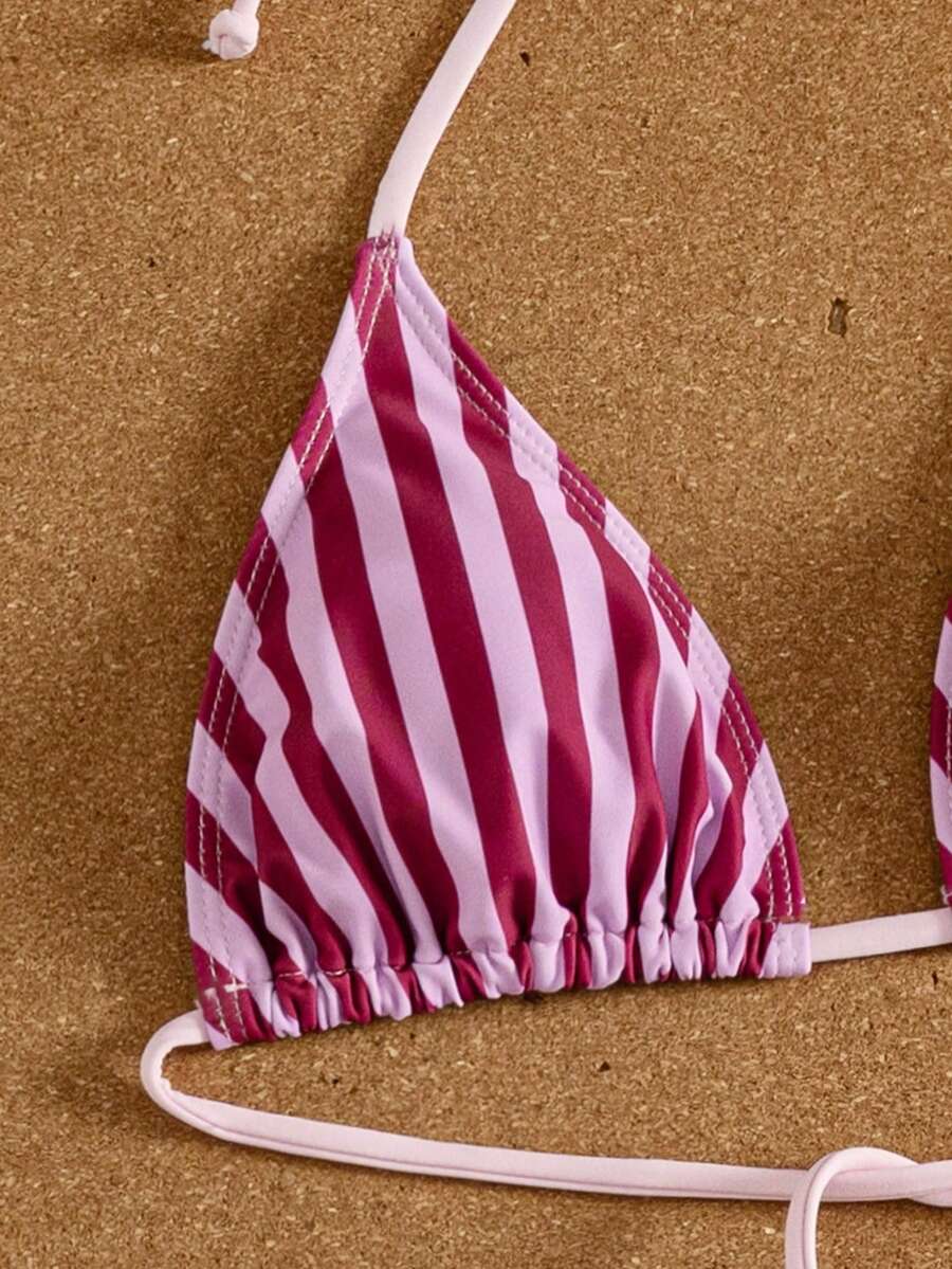 Women's striped halter two-piece swimsuit featuring a lace-up triangle top with removable padding and high-cut low-waist bikini bottoms.