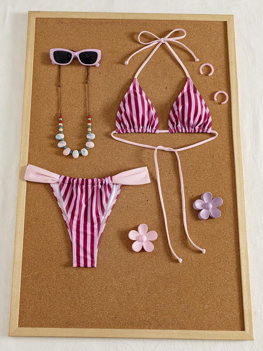 Women's striped halter two-piece swimsuit featuring a lace-up triangle top with removable padding and high-cut low-waist bikini bottoms.