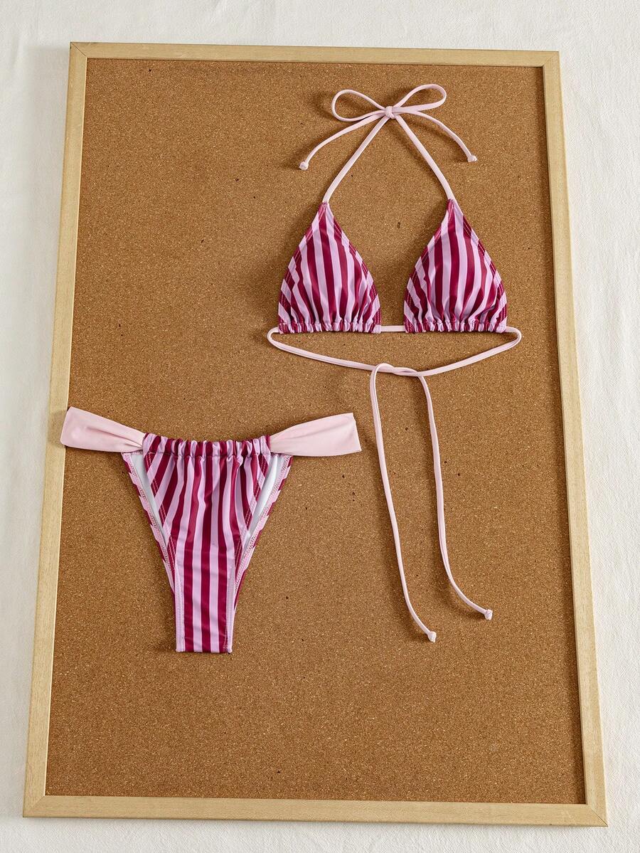 Women's striped halter two-piece swimsuit featuring a lace-up triangle top with removable padding and high-cut low-waist bikini bottoms.