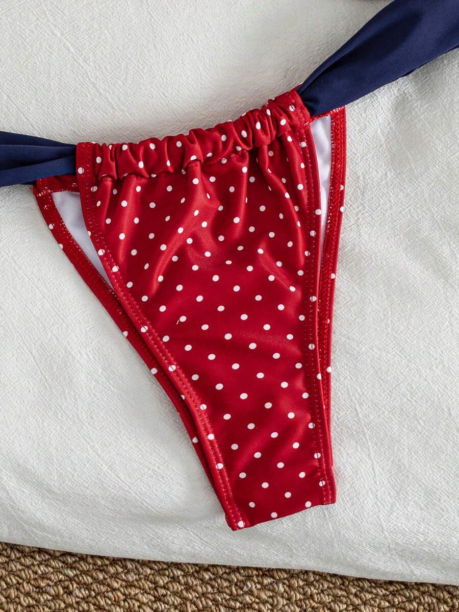Women's striped halter two-piece swimsuit featuring a lace-up triangle top with removable padding and high-cut low-waist bikini bottoms.