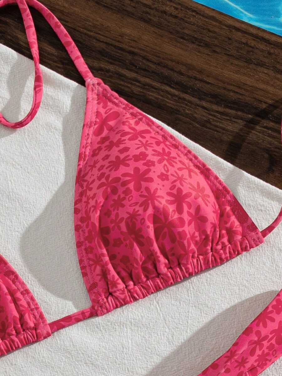 Women's striped halter two-piece swimsuit featuring a lace-up triangle top with removable padding and high-cut low-waist bikini bottoms.
