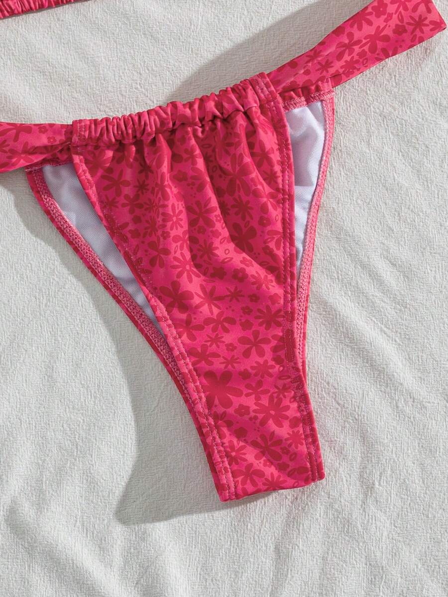 Women's striped halter two-piece swimsuit featuring a lace-up triangle top with removable padding and high-cut low-waist bikini bottoms.