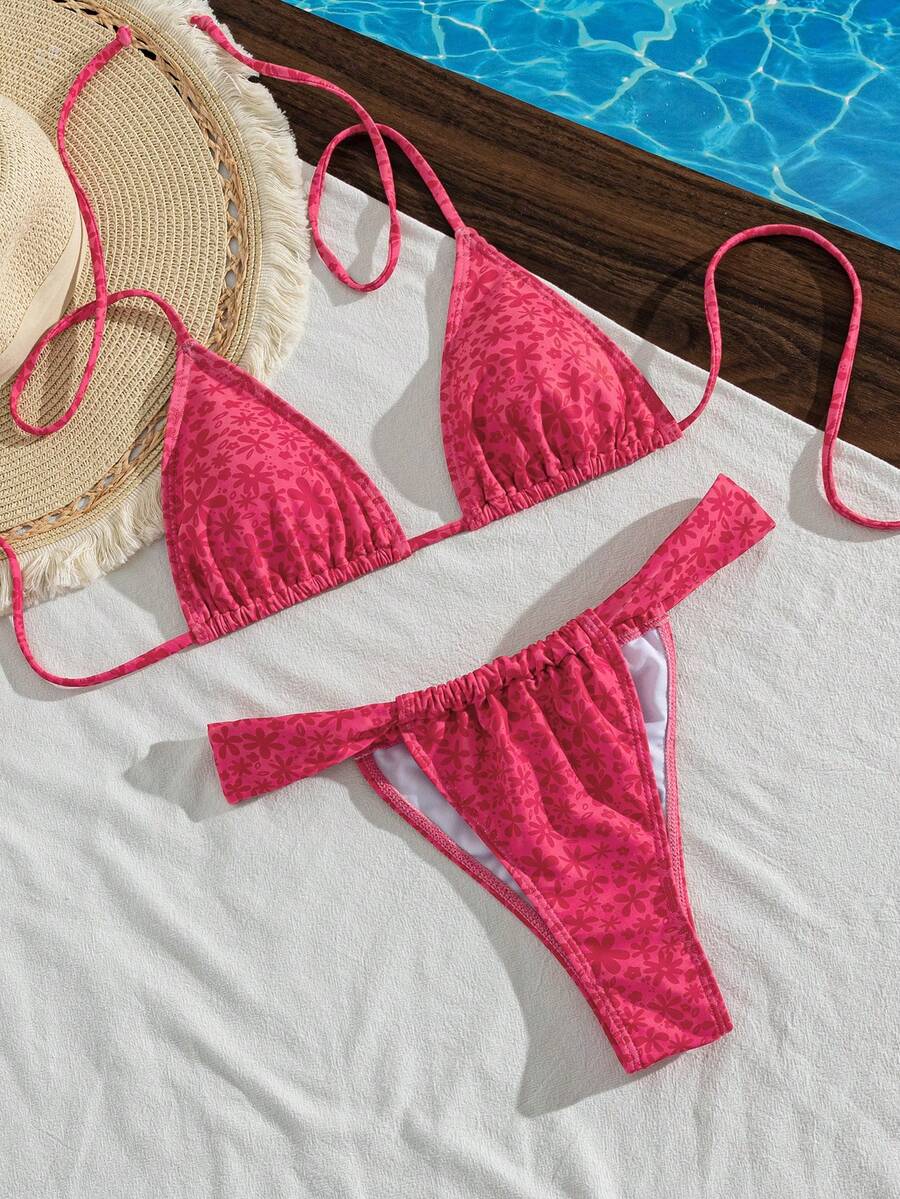 Women's striped halter two-piece swimsuit featuring a lace-up triangle top with removable padding and high-cut low-waist bikini bottoms.