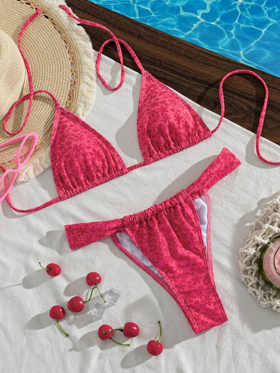 Women's striped halter two-piece swimsuit featuring a lace-up triangle top with removable padding and high-cut low-waist bikini bottoms.