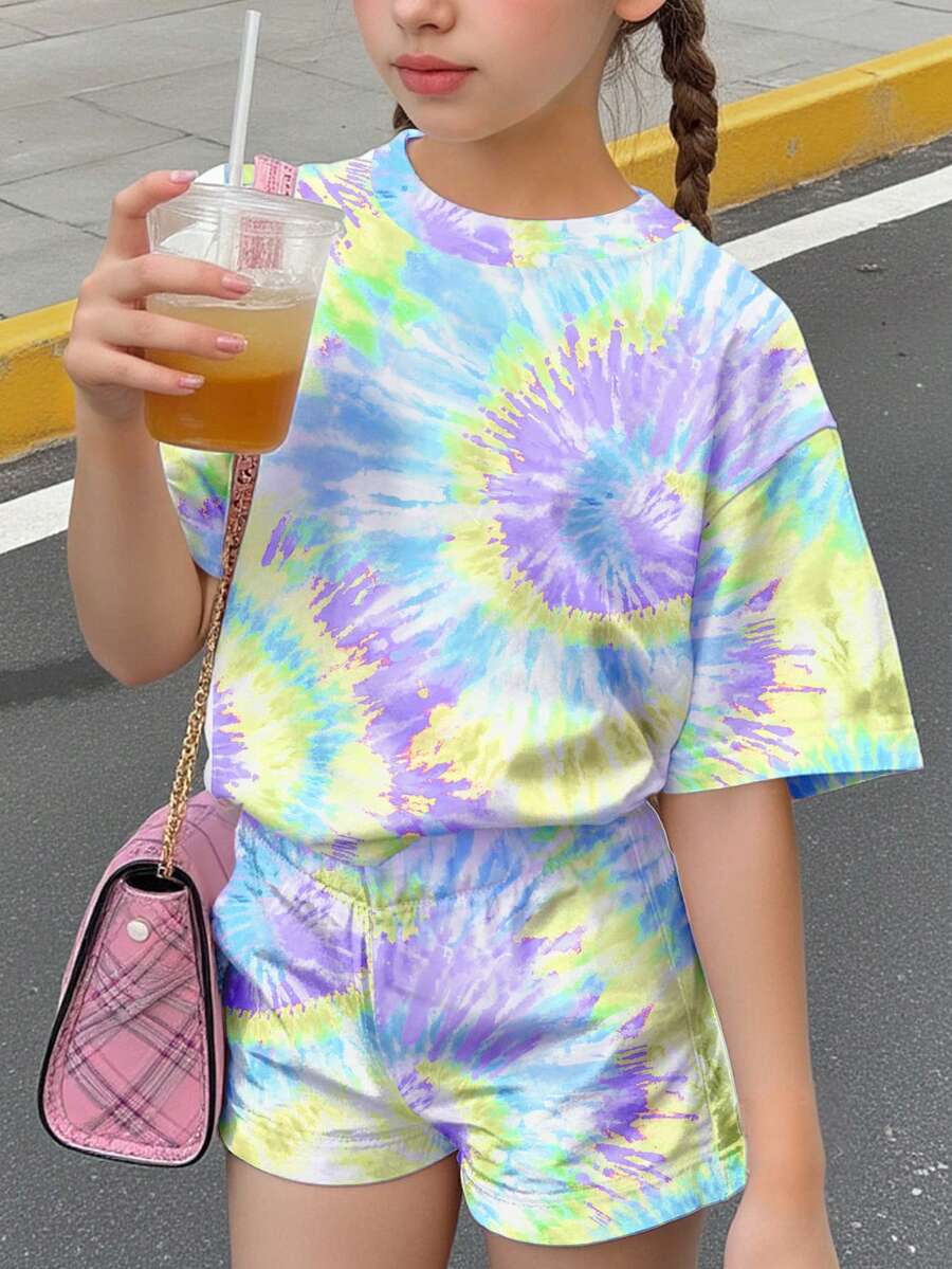 Tween girls multicolor tie-dye 2-piece outfit set featuring a drop-shoulder short-sleeve t-shirt and matching loose track shorts with side pockets.