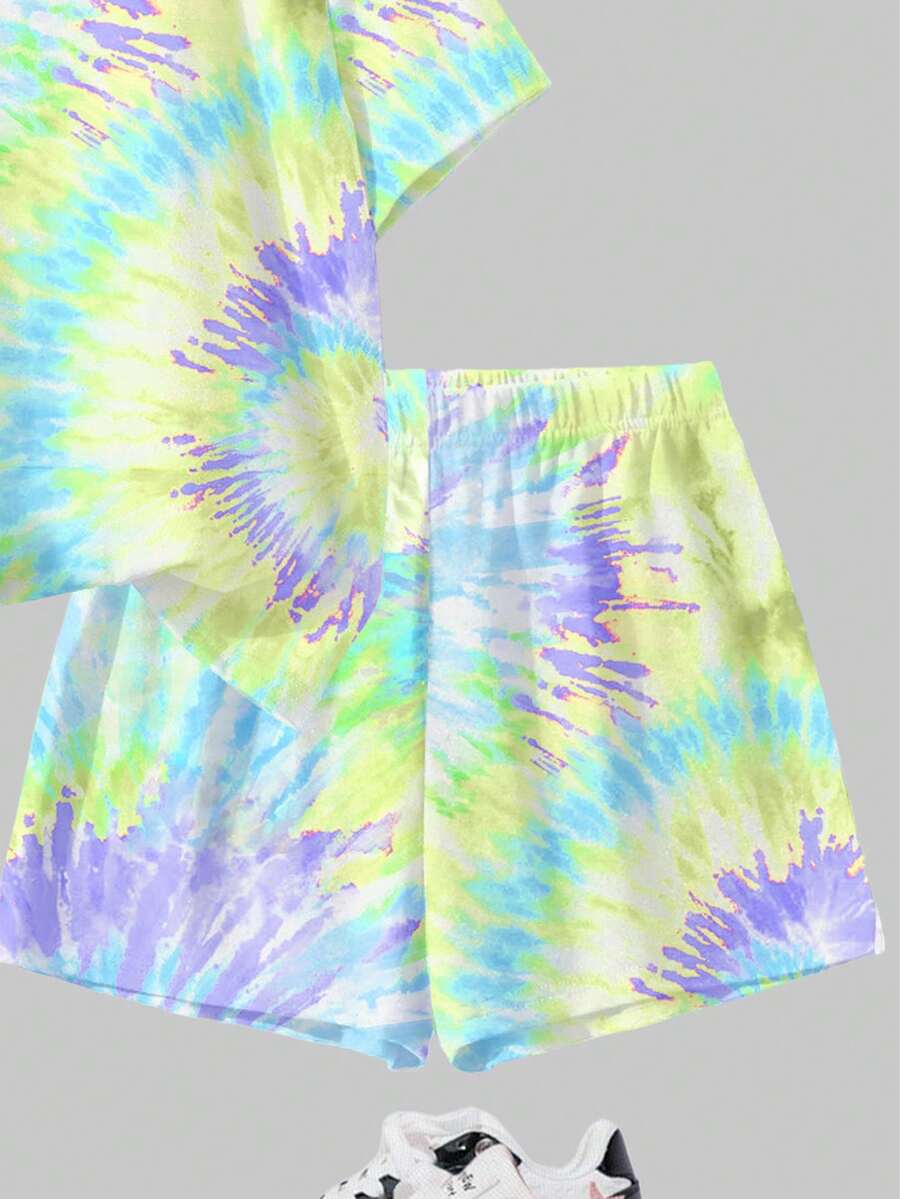 Tween girls multicolor tie-dye 2-piece outfit set featuring a drop-shoulder short-sleeve t-shirt and matching loose track shorts with side pockets.