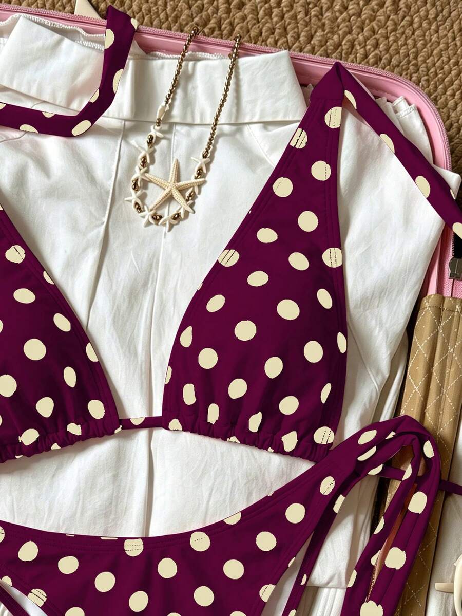 Women's polka dot two-piece bikini set featuring a backless halter top with triangle cups and matching tie-side bottoms.