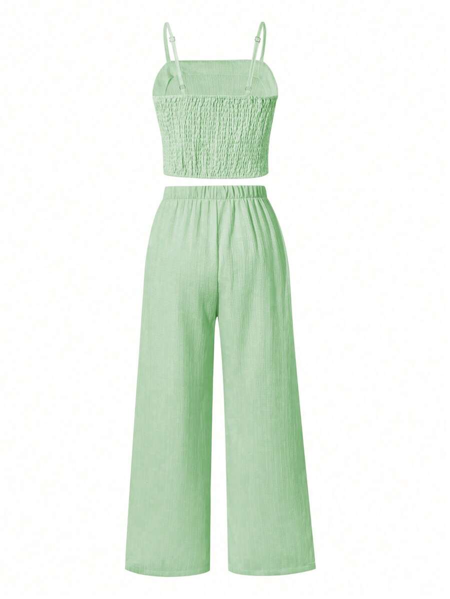 Tween girls casual 2-piece set featuring an apricot woven camisole crop top with back shirring and matching high-waisted loose long pants.