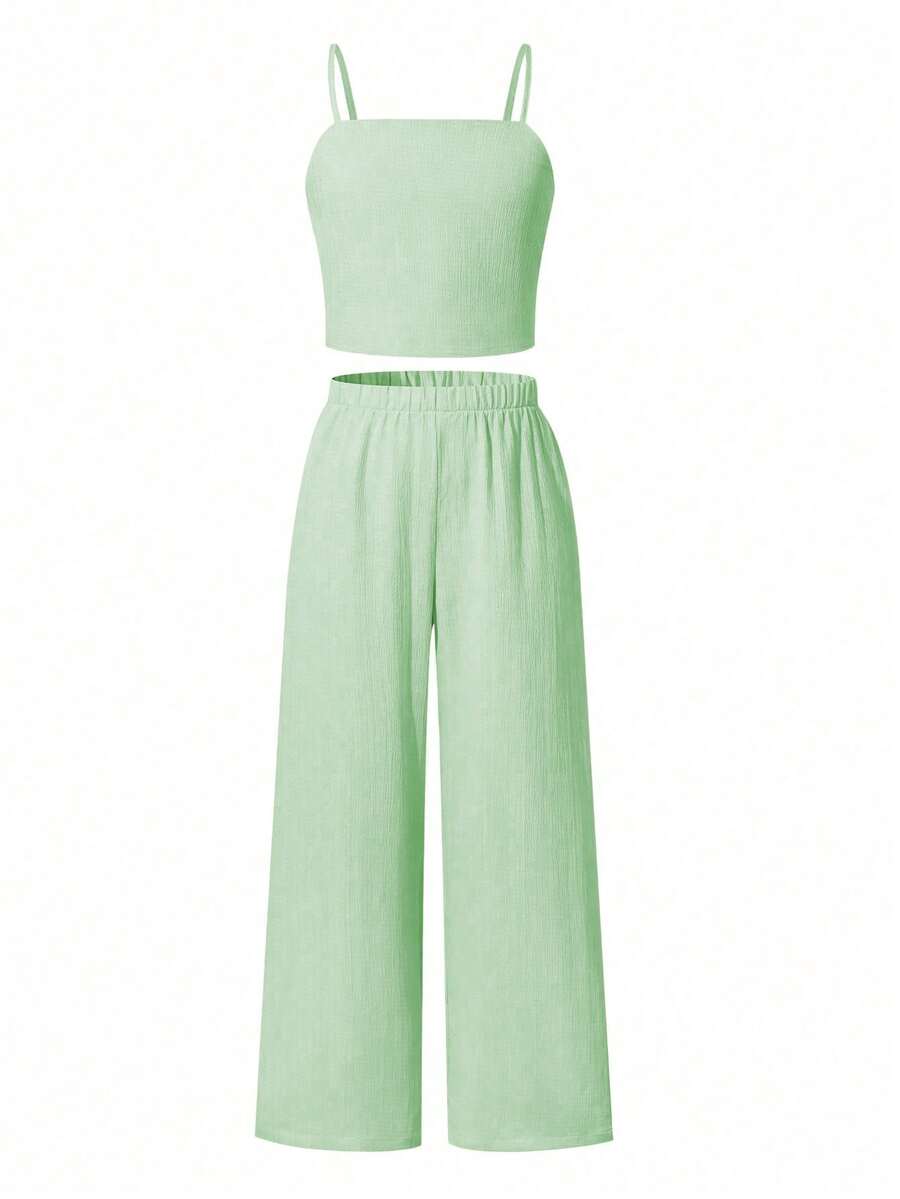 Tween girls casual 2-piece set featuring an apricot woven camisole crop top with back shirring and matching high-waisted loose long pants.