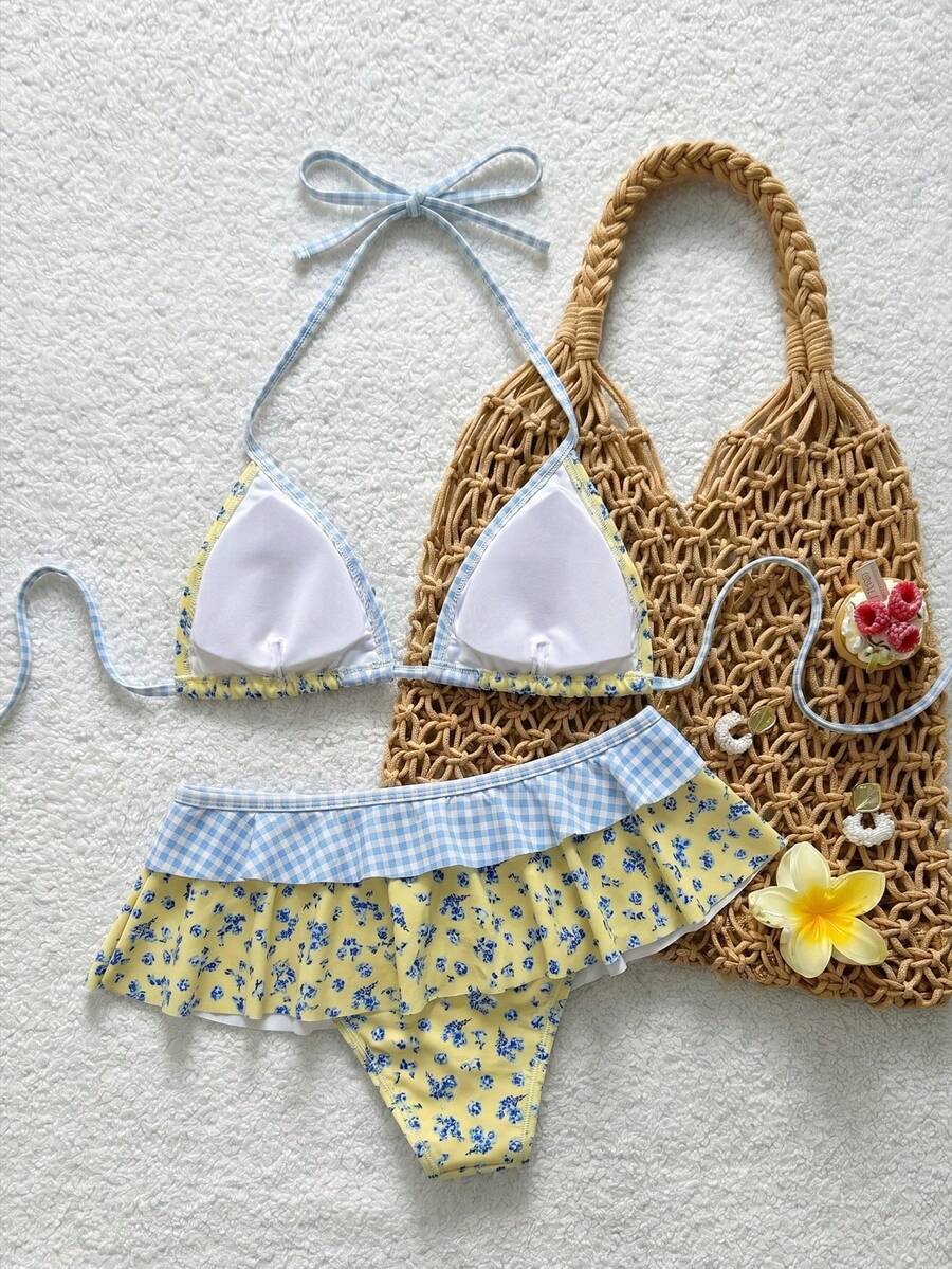 Women's ruffled halter two-piece bikini set with low waist bottoms and wireless triangle cups.