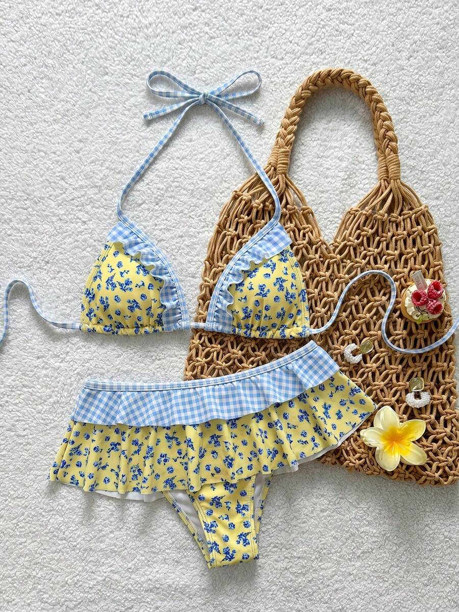 Women's ruffled halter two-piece bikini set with low waist bottoms and wireless triangle cups.