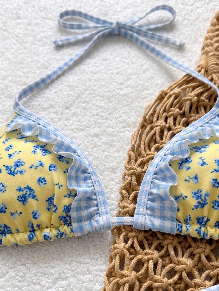 Women's ruffled halter two-piece bikini set with low waist bottoms and wireless triangle cups.