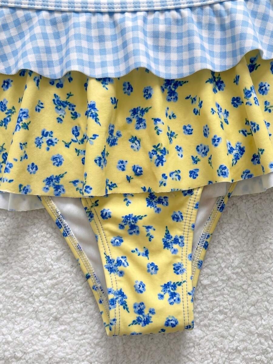 Women's ruffled halter two-piece bikini set with low waist bottoms and wireless triangle cups.