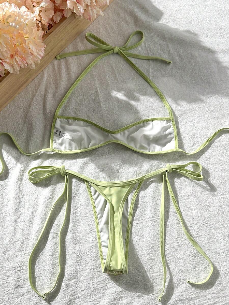 Apricot 2-piece sequin textured halter bikini set featuring a wireless top with lace-up backless ties and matching low-waist side-tie thong bottoms.