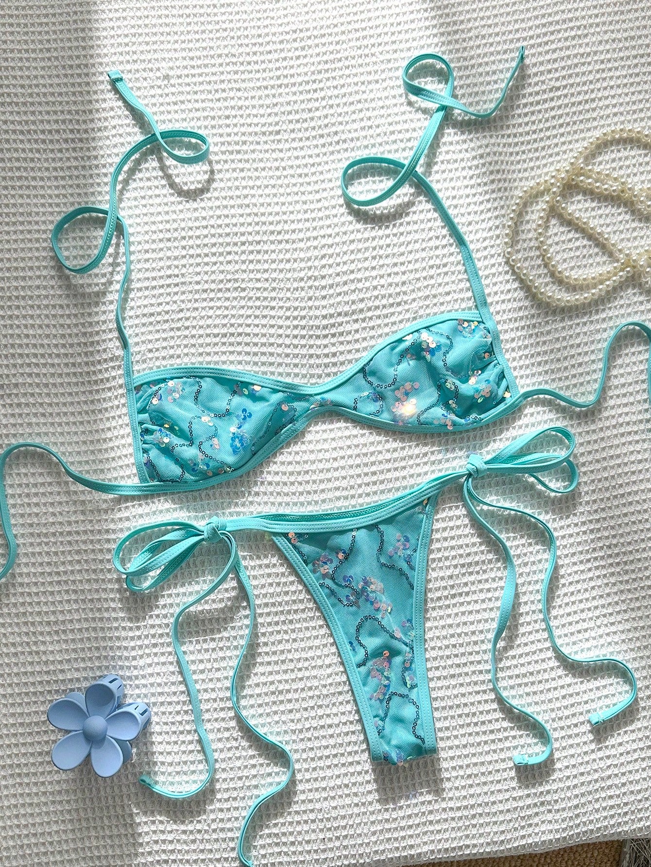 Apricot 2-piece sequin textured halter bikini set featuring a wireless top with lace-up backless ties and matching low-waist side-tie thong bottoms.