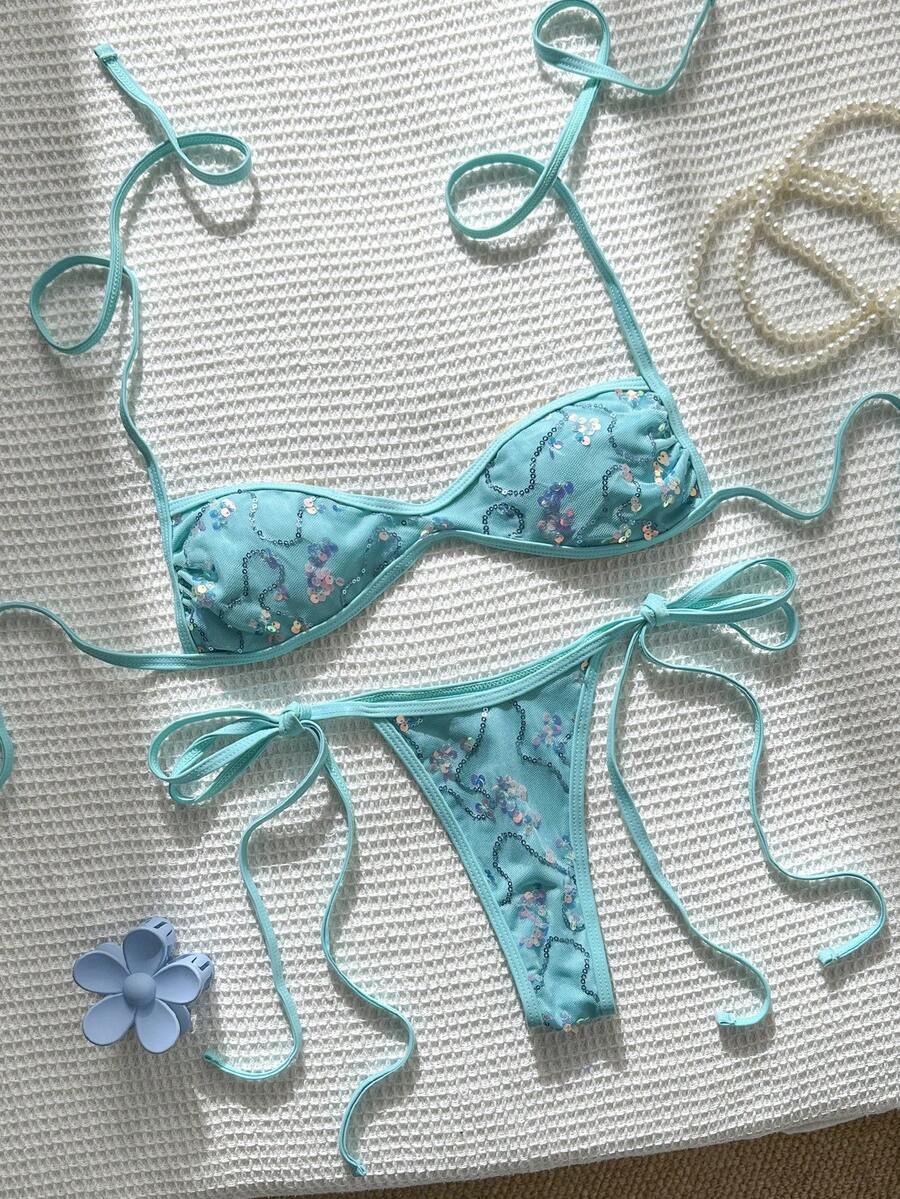 Apricot 2-piece sequin textured halter bikini set featuring a wireless top with lace-up backless ties and matching low-waist side-tie thong bottoms.